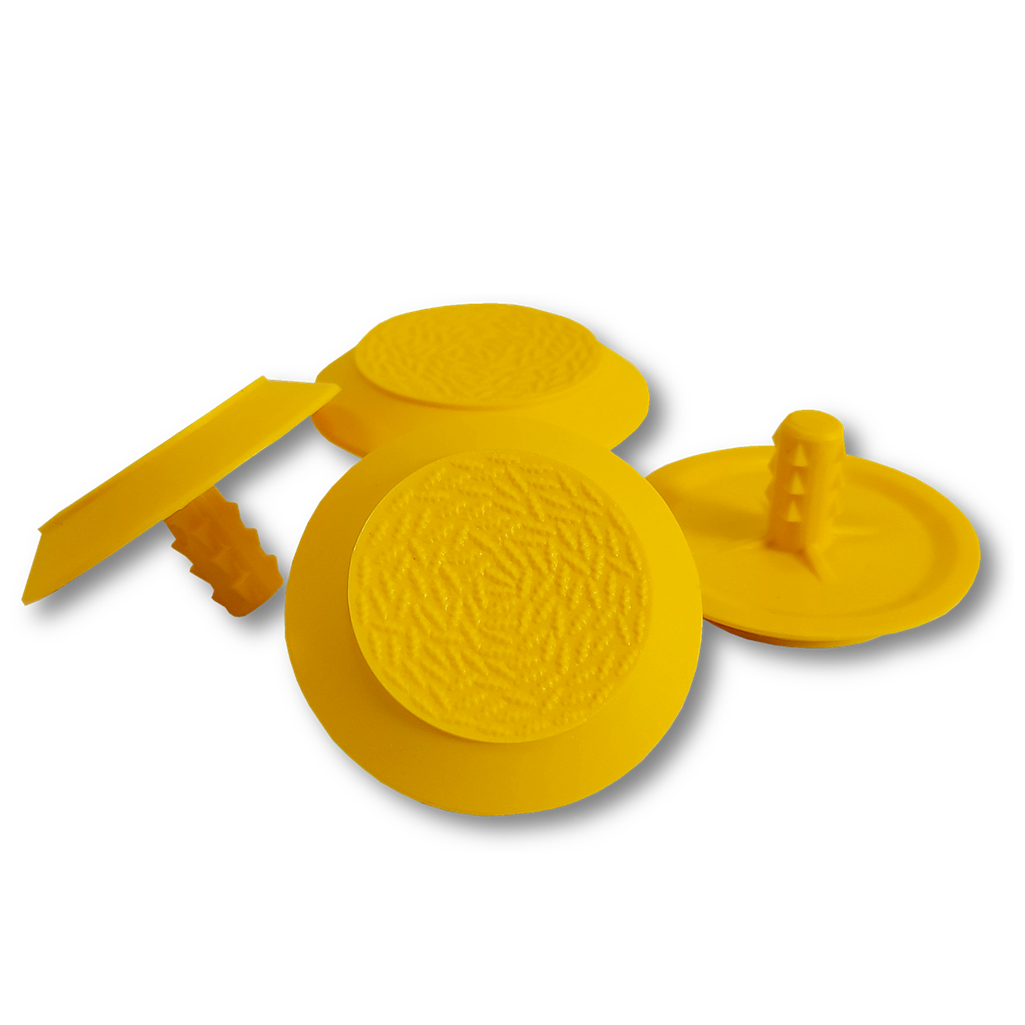 Four TacPro yellow polyurethane tactile indicator warning studs. Main product photo