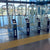 TacPro yellow polyurethane tactile indicator warning studs on both sides of train station tag on turnstiles