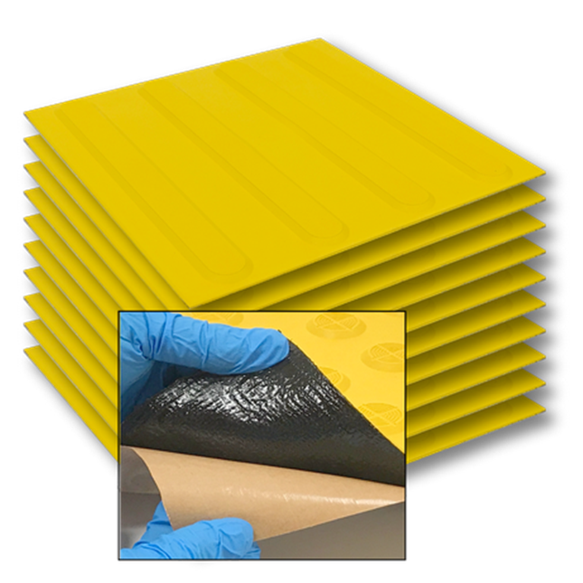 Stack of TacPro yellow peel-and-stick tactile directional indicator tiles with popout image of bituminous backing for context
