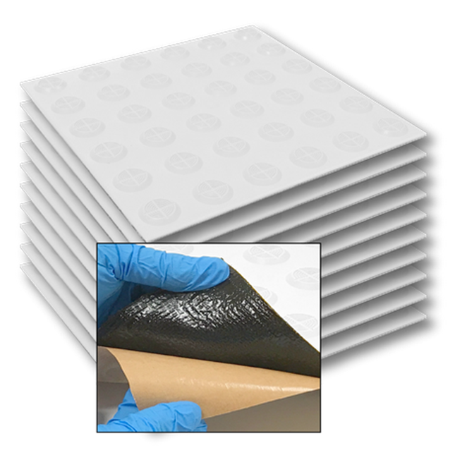 Stack of TacPro white peel-and-stick warning tactile indicator tiles with popout of bituminous backing for context.