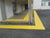 TacPro yellow peel-and-stick tactile indicator warning tiles at top and bottom of stairs to classrooms
