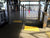 TacPro yellow peel-and-stick tactile indicator warning tiles installed on either side of a train station ticket gate