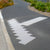 TacPro white polyurethane tactile warning and directional indicators installed on lightly exposed aggregate concrete pram ramp