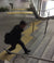 High angle of man using stairs. TacPro yellow polyurethane tactile indicator warning studs at top and bottom of stairs