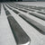Close-up of TacPro stainless steel tactile directional indicators installed to concerete.
