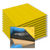 Stack of TacPro yellow peel-and-stick tactile directional indicator tiles with popout image of bituminous backing for context